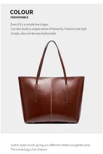 Detailed view of the central seam stitching and glossy brown leather on the tote bag