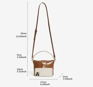 Detailed dimensions of the brown leather handbag with gold twist-lock and shoulder strap