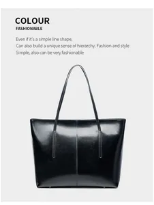 Detail of glossy black leather tote bag showing premium polished texture and stitching