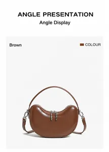 Front view of a brown leather crescent handbag with double zipper and silver metal hardware