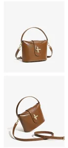 Detail of premium brown leather handbag featuring golden cross turn-lock and smooth finish