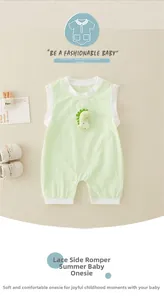 Detail of mint green cotton baby romper with 3D dinosaur patch and snap buttons