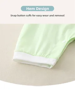 Close-up of baby romper leg cuffs with soft white ribbing and snap button closure