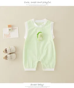 Detail of light green sleeveless baby bodysuit featuring a plush dinosaur and snap buttons