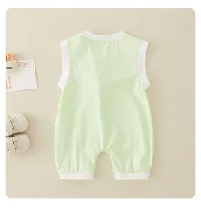 Detail view of the back of a light green sleeveless cotton baby romper with white edging