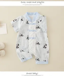 Detail of newborn baby romper with traditional Chinese frog button and panda prints