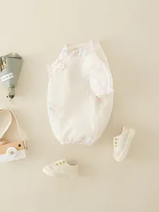 Floral Chinese style newborn baby girl romper with puff sleeves and button detail