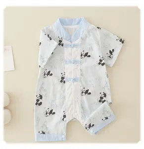 Close-up of baby panda romper featuring traditional Chinese knot buttons and cotton fabric