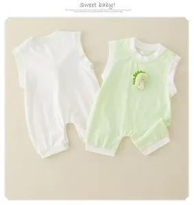 Detail of baby sleeveless cotton rompers featuring 3D dinosaur patch and snap buttons