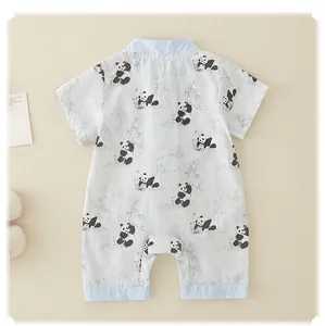 Detail view of baby romper featuring panda bamboo prints and premium cotton fabric
