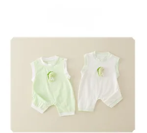 Detail of baby sleeveless cotton rompers with side snap buttons and 3D dinosaur decor