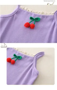 Detail of baby purple ribbed cotton bodysuit with lace trim and cherry embroidery