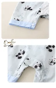 Detail of baby romper featuring panda print, blue ribbing, and bottom snap buttons