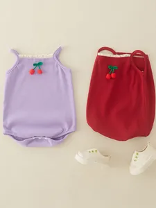 Cotton baby bodysuit with cherry appliques and lace trim in purple and red colors