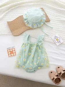 Mint green daisy print baby romper with matching sun hat featuring delicate ruffle tulle details