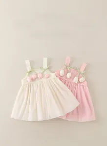 Detail of baby girl summer dresses with tulip floral accents and pleated tulle design