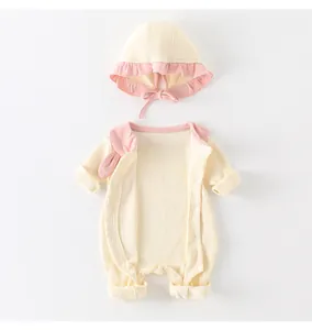 Detail of baby ribbed cotton romper with pink wavy collar and matching soft sun hat