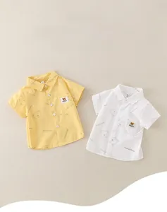 Close-up of lightweight cotton kids shirts with cute bear print and chest pocket detail