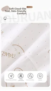 Detailed macro view of white combed cotton fabric with brown dots and INWU print