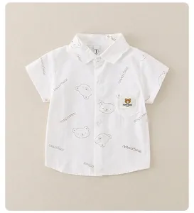 Detail of white short sleeve toddler shirt with bear prints and a small chest pocket