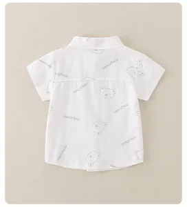 Detail of white cotton short sleeve shirt with cute bear and letter print for kids