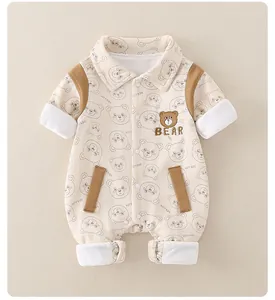 Close-up of cotton baby romper featuring bear embroidery and ribbed cuffs