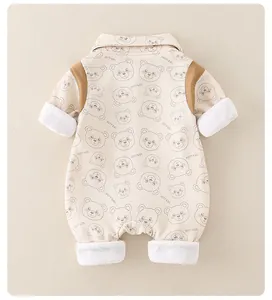 Close-up of baby romper featuring beige ribbed cotton fabric and cartoon bear prints