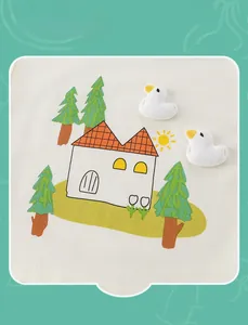 Detailed close-up of cartoon house and 3D duck embroidery on cotton fabric