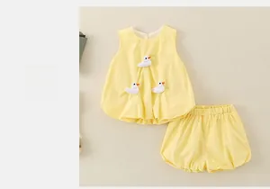 Detail of yellow toddler summer set featuring 3D duck appliques and elastic waist