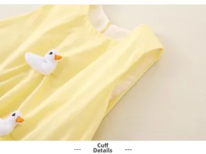 Close-up of the breathable yellow fabric cuff featuring 3D white plush duck decorations