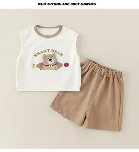 Detail of baby cotton two-piece set featuring a smart bear print and shoulder buttons