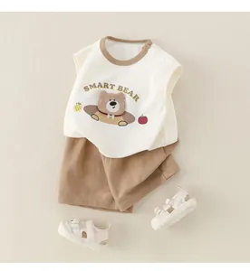 Flat lay of baby boy cotton summer set with sleeveless bear vest and brown shorts