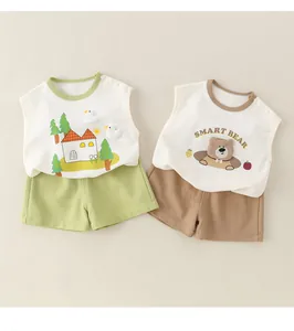 Detail of baby cotton summer set featuring shoulder buttons and smart bear embroidery