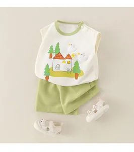 Flat lay of cream sleeveless baby vest with duck applique and green shorts set