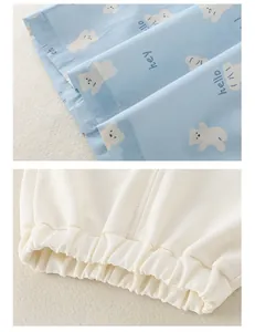 Detail of soft blue cotton fabric with bear prints and breathable white mesh elastic cuff