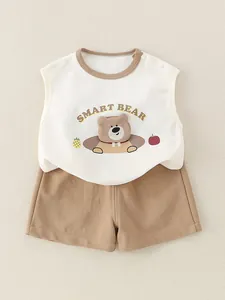Cotton baby boy summer set featuring a white sleeveless bear vest and brown shorts