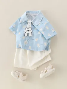 Toddler boys light blue cotton summer outfit with cartoon bear prints and white shorts