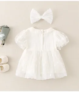 Detailed set of white baby tutu dress with floral lace headband and soft shoes