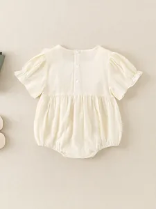 Short sleeve cotton baby bodysuit in cream white with puff sleeves and button back