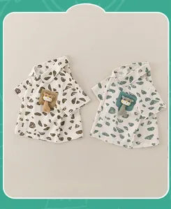Detail of short sleeve toddler shirts with leopard print and cute giraffe pocket toys