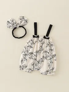 Baby girl summer cotton floral romper set with matching bow headband in cream white