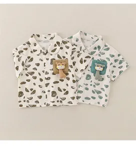 Close-up of cotton boys shirts with polka dots and 3D giraffe doll on pockets
