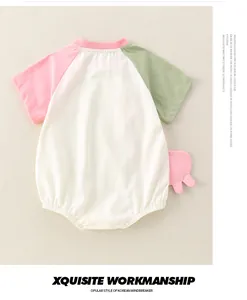 Close-up of baby short sleeve romper featuring color-block design and soft cotton texture