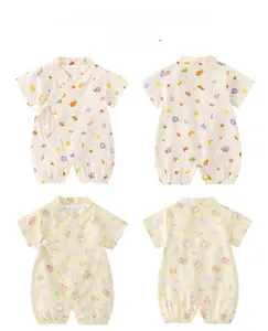 Detail view of cotton summer baby rompers with kimono lace-up and cute cartoon patterns