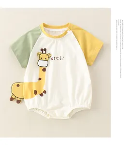 Detail of baby bodysuit featuring cotton fabric and cute giraffe embroidery with NICE text