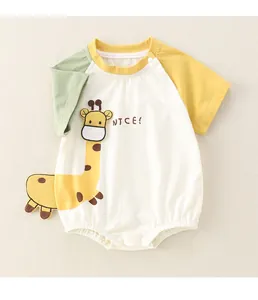 Detail of baby short sleeve romper with colorful raglan sleeves and giraffe print