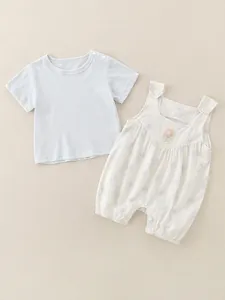 Newborn baby summer set with blue t-shirt and floral embroidered white overalls