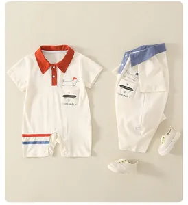 Detail of baby cotton polo romper with cartoon dog print and striped leg cuffs
