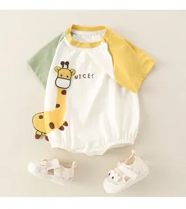 Detail of newborn short sleeve romper with giraffe embroidery and mesh sandals
