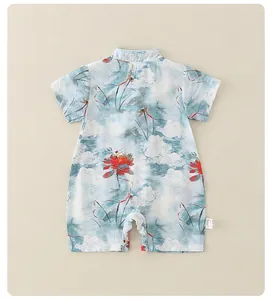 Detail of infant short-sleeve romper with traditional Chinese lotus pattern and cloud prints